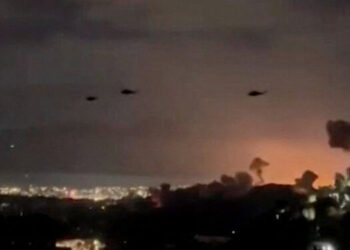 Helicopters fly past plumes of smoke rising from explosions, in Caracas, Venezuela, January 3, 2026 in this screen grab obtained from video obtained by Reuters. Video Obtained by Reuters/via REUTERS  THIS IMAGE HAS BEEN SUPPLIED BY A THIRD PARTY. NO RESALES. NO ARCHIVES. NEWS USE ONLY. THIS PICTURE WAS PROCESSED BY REUTERS TO ENHANCE QUALITY. AN UNPROCESSED VERSION HAS BEEN PROVIDED SEPARATELY.  VERIFICATION: - Mountains, towers and buildings match satellite and file imagery of Caracas  - Date verified by multiple corroborating videos of strikes on Caracas      TPX IMAGES OF THE DAY