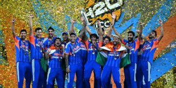 India's players celebrate with the trophy after winning the 2026 ICC Men's T20 Cricket World Cup final match against New Zealand at the Narendra Modi Stadium in Ahmedabad on March 8, 2026. (Photo by Punit PARANJPE / AFP)