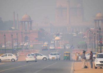 Delhi, India - November 21, 2017: Heavy traffic on the streets of New Delhi in New Delhi covered in heavy smog.