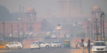 Delhi, India - November 21, 2017: Heavy traffic on the streets of New Delhi  in New Delhi covered in heavy smog.